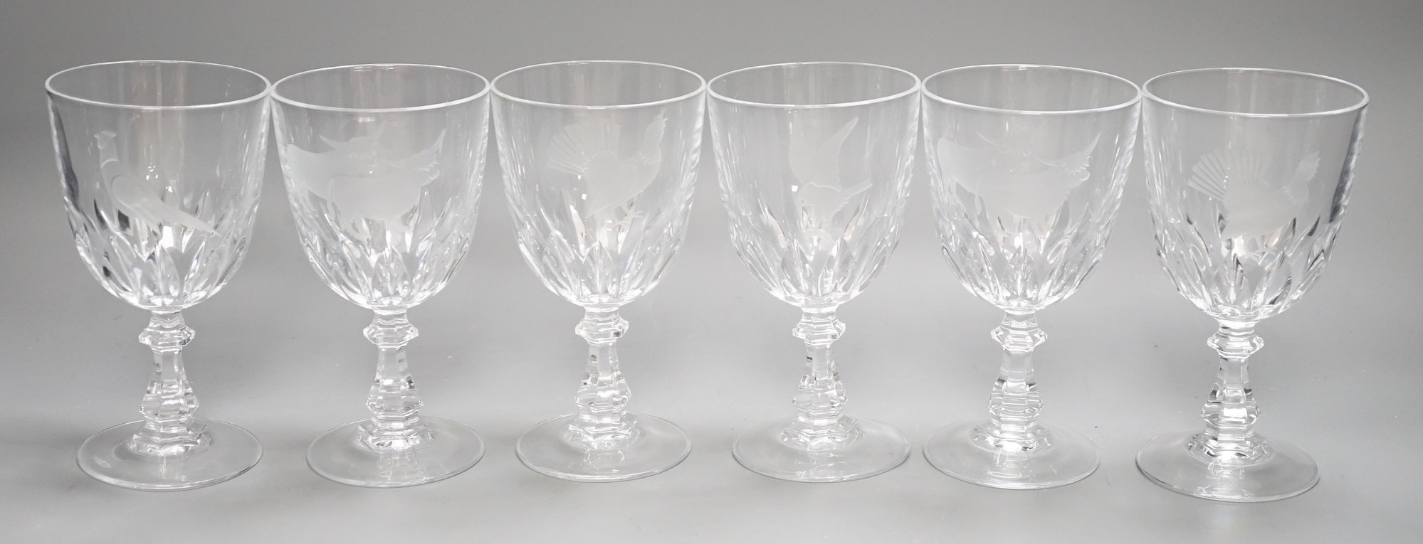 A set of six Scottish wine glasses, engraved with highland cattle and birds, 15cms high